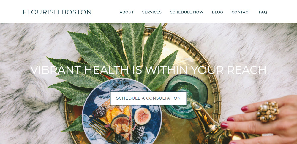 Flourish Boston acupuncture website landing page, with sumptuous images of figs and palm leaves on a golden tray.